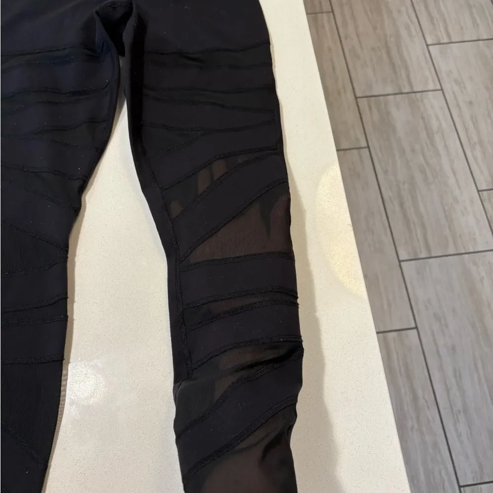 Lululemon black mesh leggings (flawed) size 4. - Picture 4 of 9